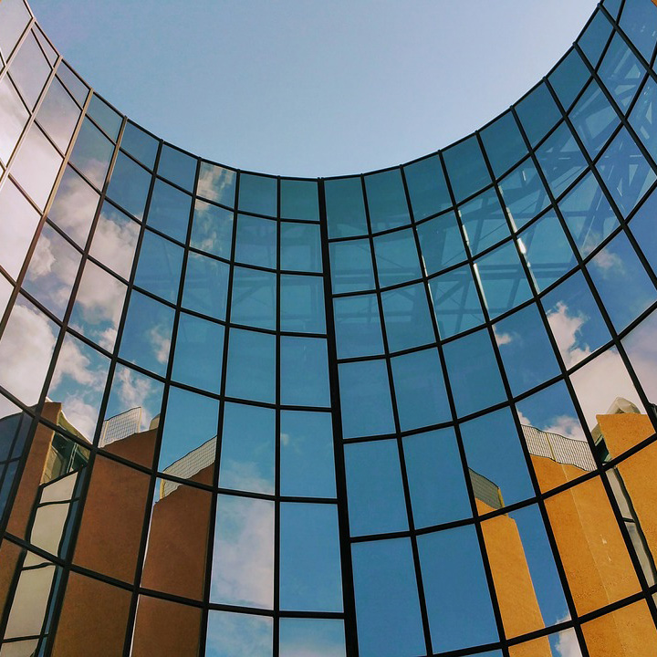 curved glass windows in an architecturally modern building