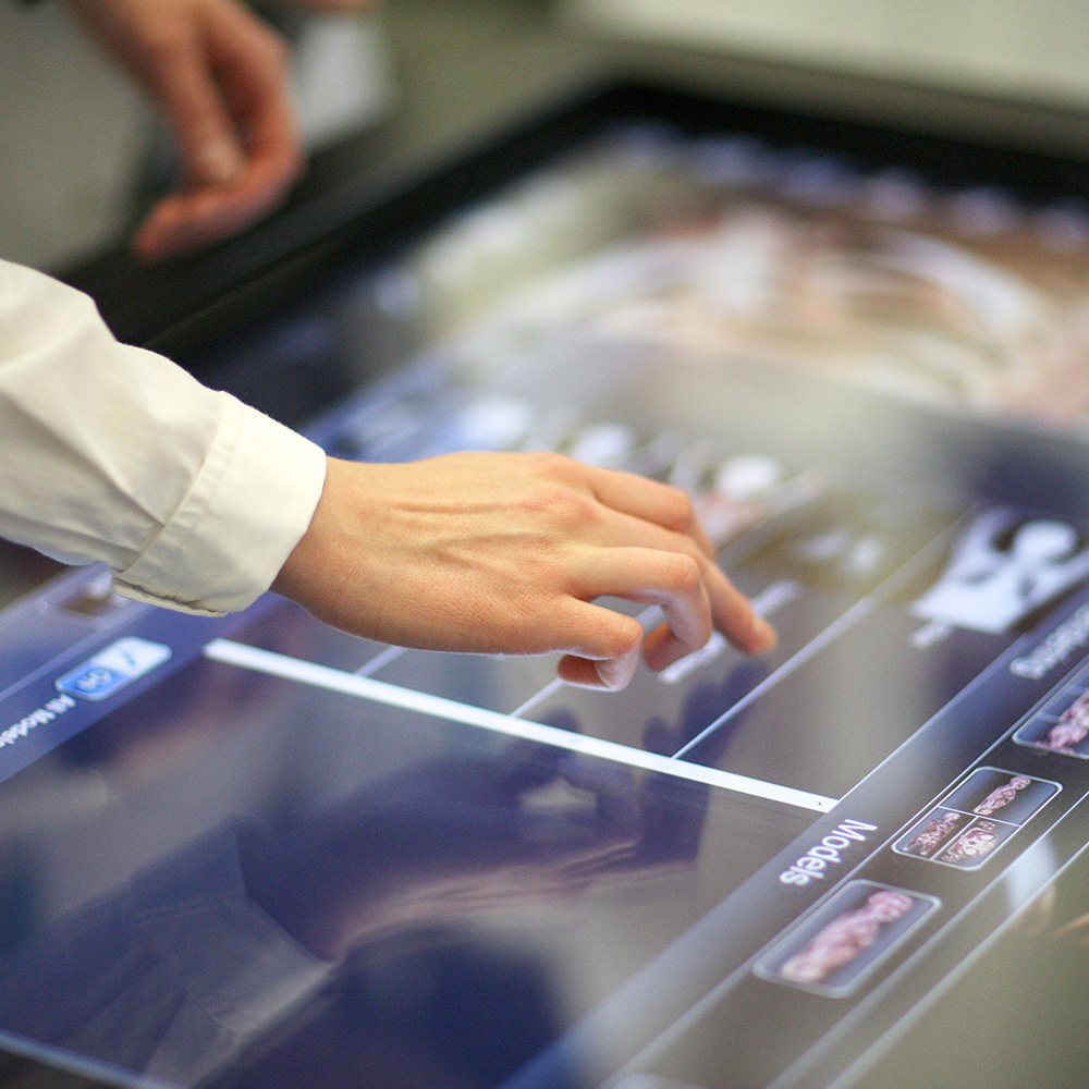 a person selecting an item through a touch screen