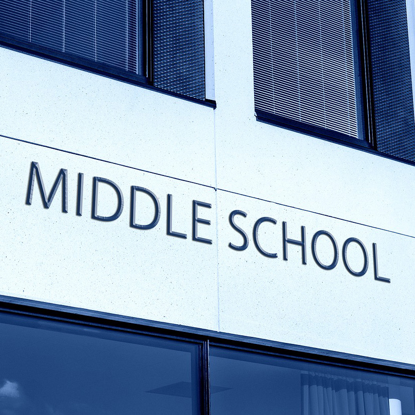 Font on the side of a school building that says MIDDLE SCHOOL